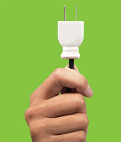 Hand holding a plug