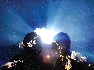 Silhouette of two people facing each other with bright light in background