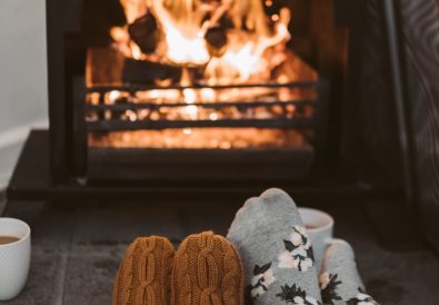 couple sitting by fireplace