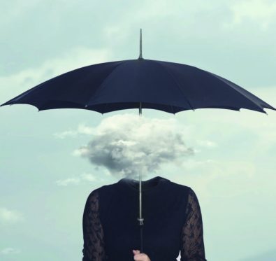 person under umbrella with head looking like a cloud