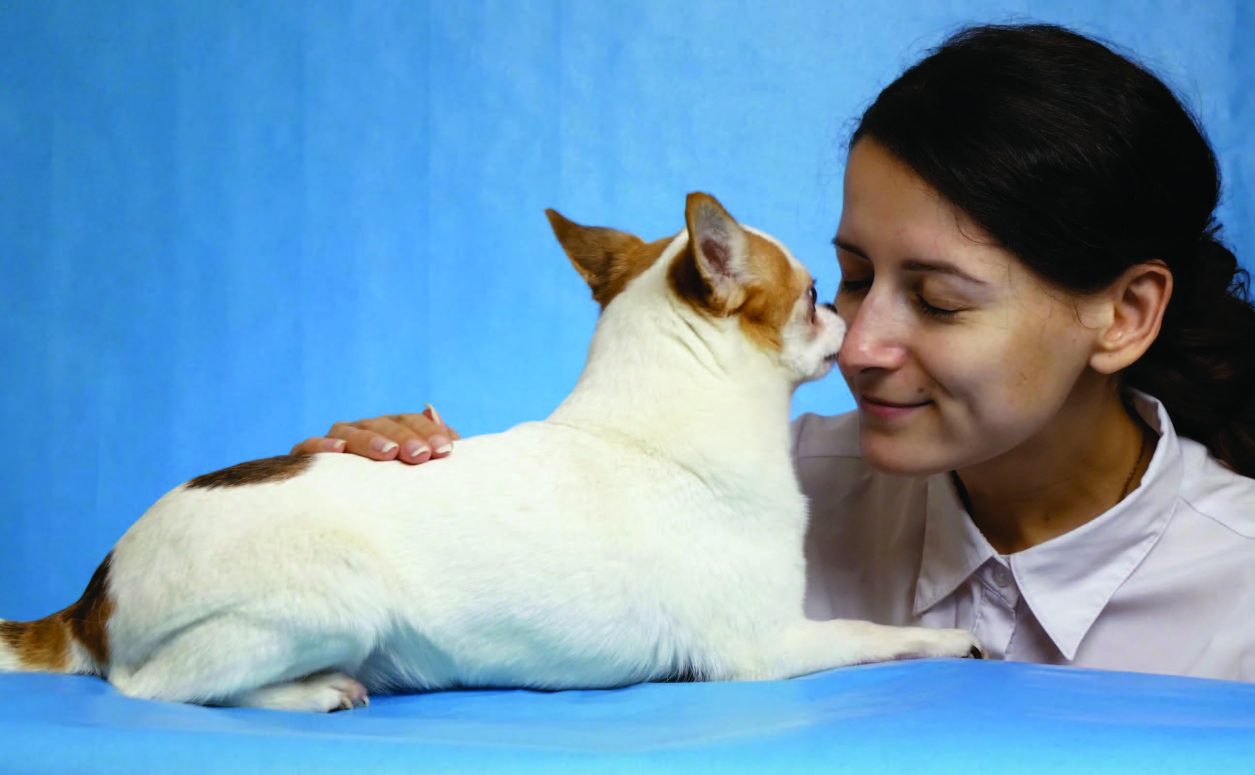 woman petting dog