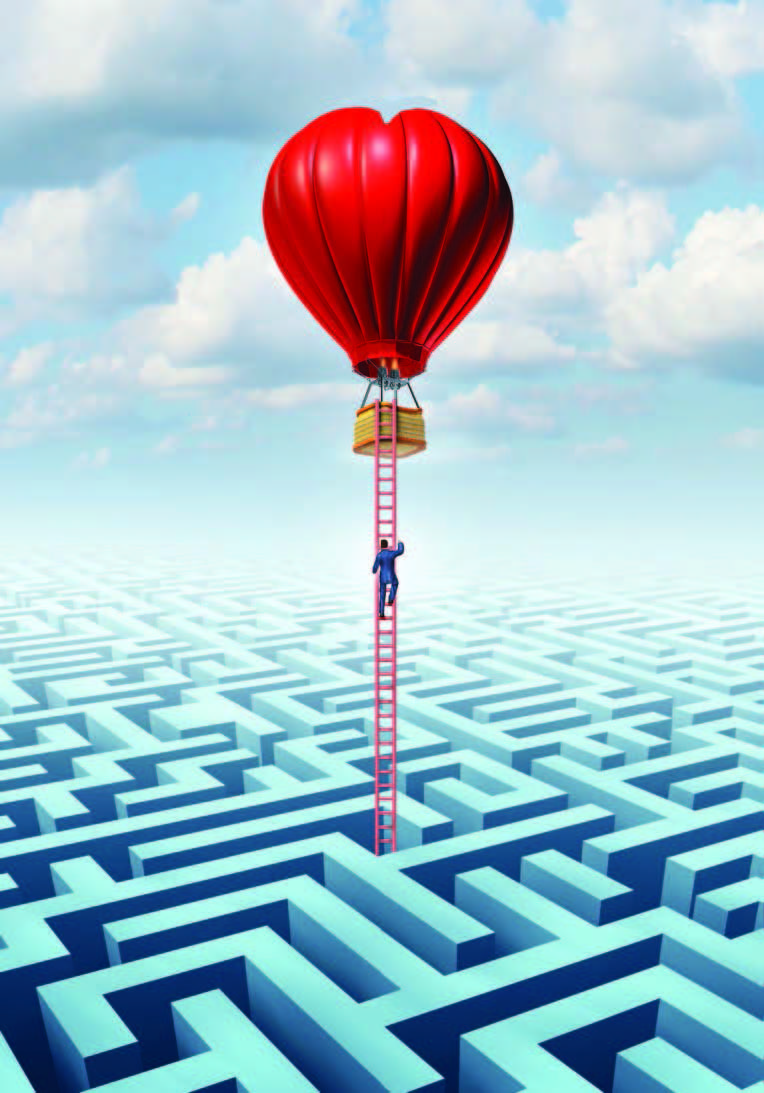 Hot air balloon flying over maze